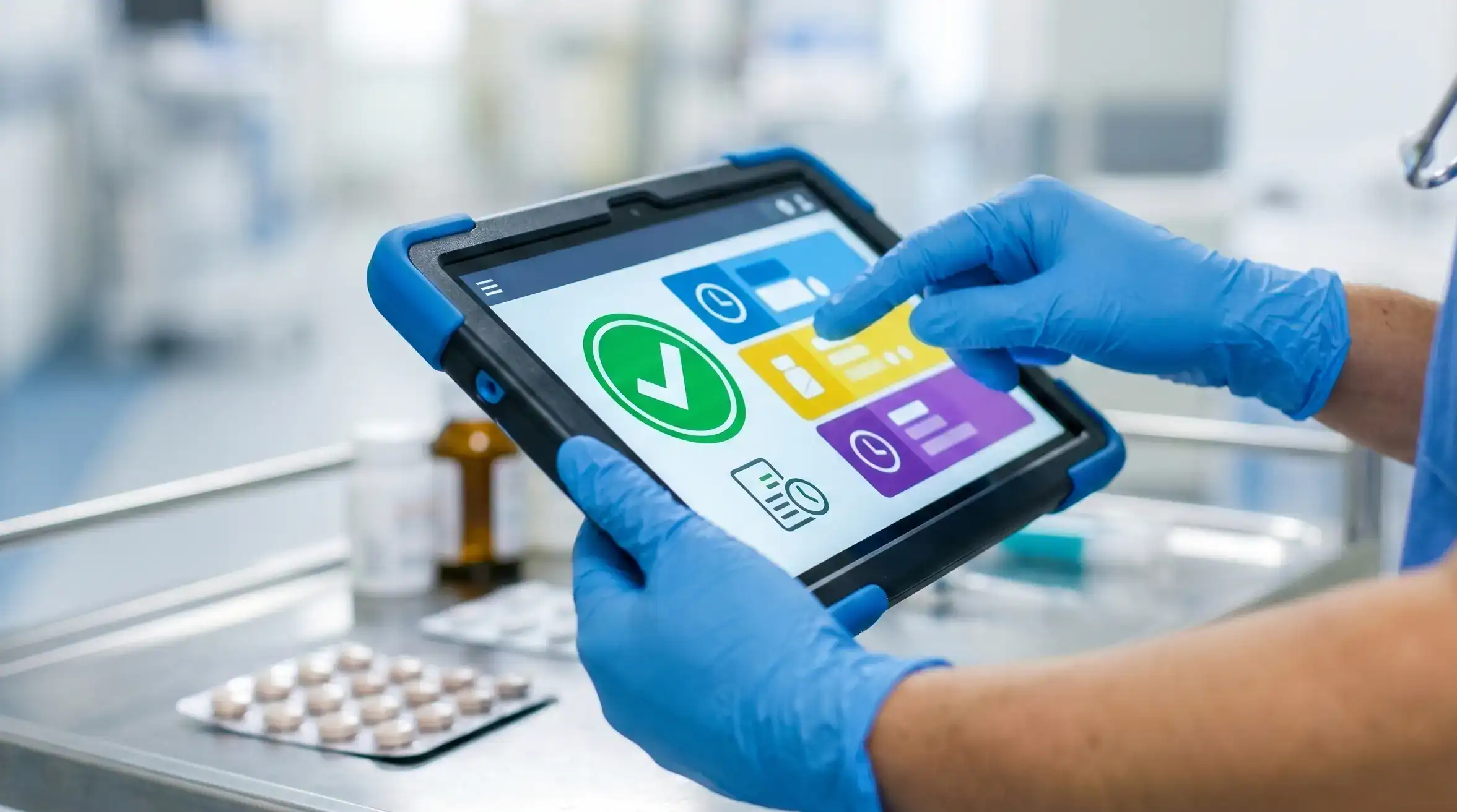 A nurse using care home management software UK to safely administer medication via a digital eMAR tablet.